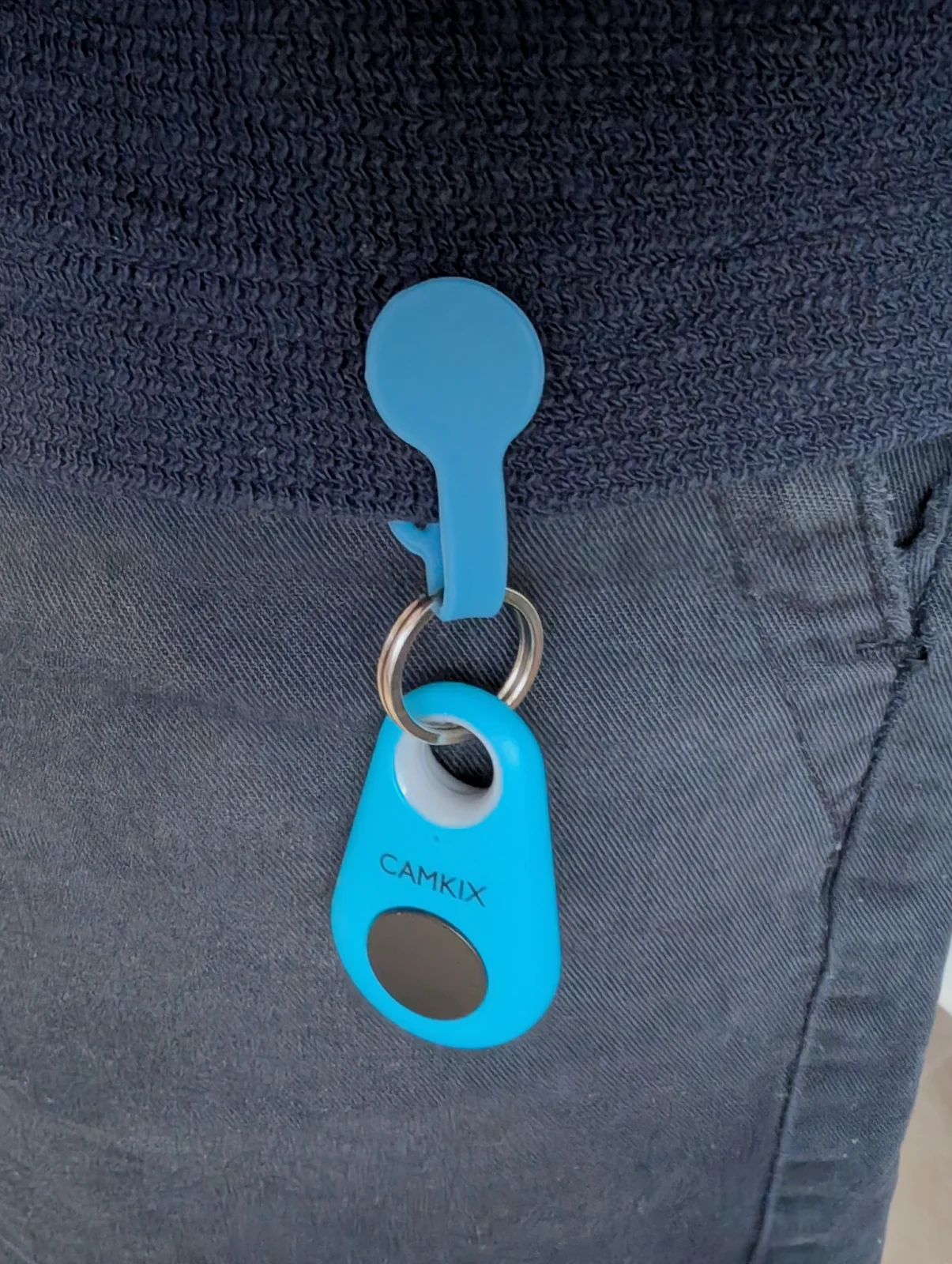 Button remote clipped onto a shirt