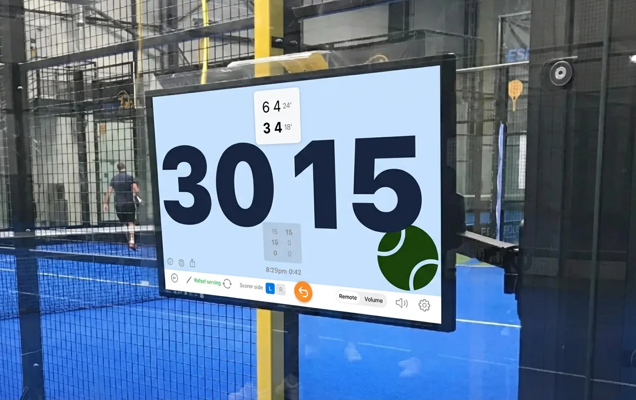 ScoreBot displayed on a large screen at a padel court