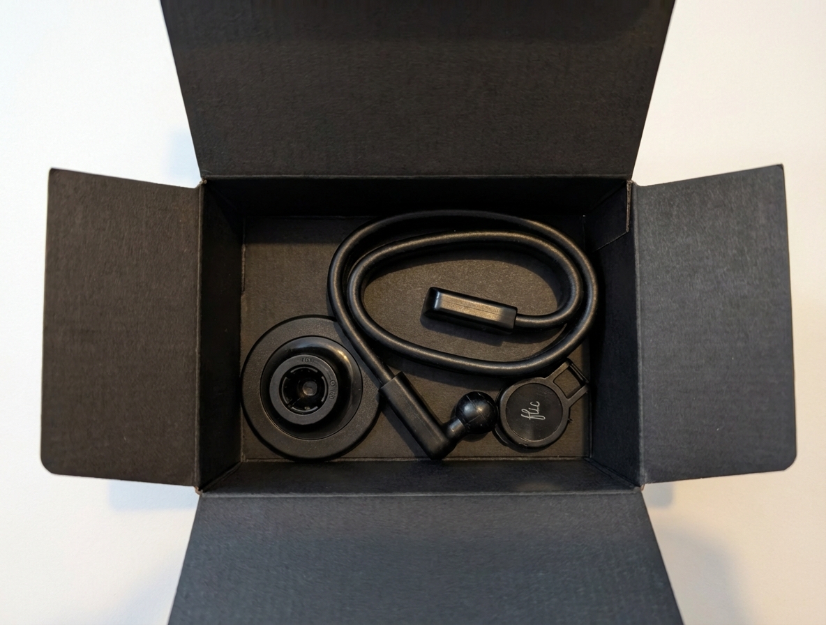 ScoreBot accessories neatly packed in a small black shipping box